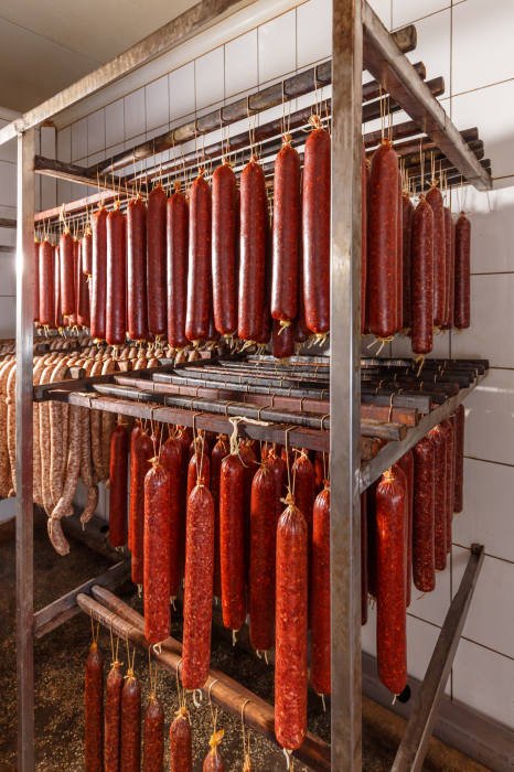 Inside the meat snack stand there is a storage room for sausages.