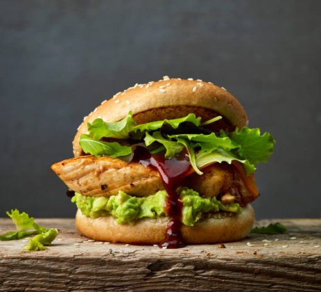 This is a delicious looking chicken burger with avocado.